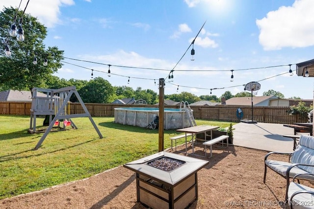 233 Murray Pl, Mannford, OK 74044 - view of yard with a fire pit, a playground, and a patio area