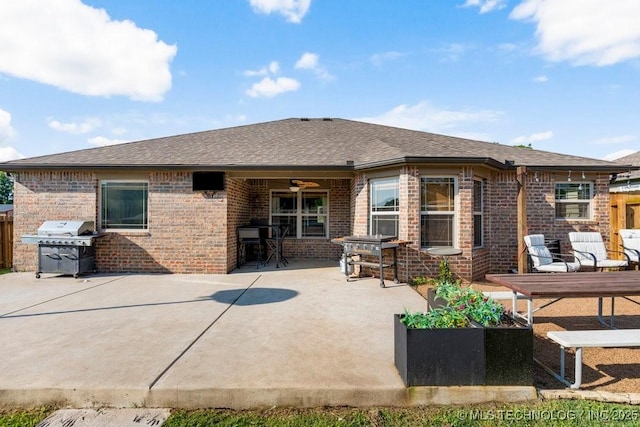 233 Murray Pl, Mannford, OK 74044 - back of house featuring brick siding, a patio area, and roof with shingles