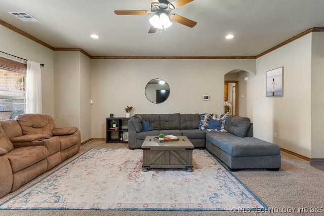 233 Murray Pl, Mannford, OK 74044 - carpeted living area with arched walkways, baseboards, ceiling fan, crown molding, and recessed lighting