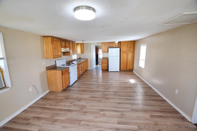 215 S Maple Ave, Tahlequah, OK 74464 - kitchen featuring white appliances, under cabinet range hood, a sink, baseboards, and light wood-type flooring