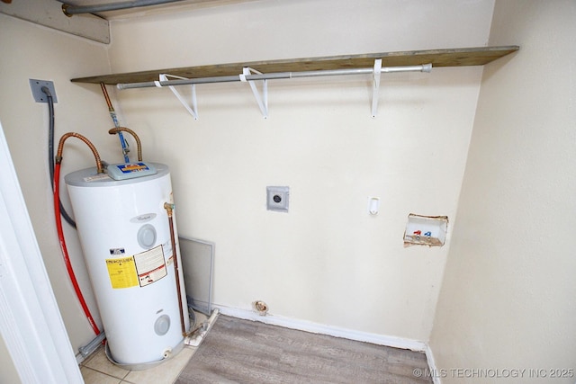 215 S Maple Ave, Tahlequah, OK 74464 - laundry area with hookup for an electric dryer, water heater, washer hookup, and light wood-style flooring