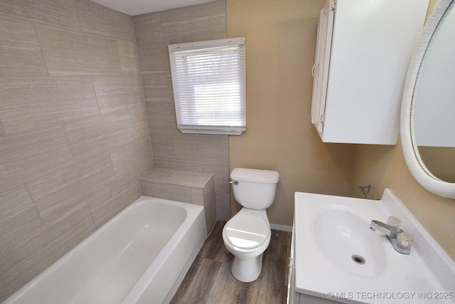 215 S Maple Ave, Tahlequah, OK 74464 - bathroom with toilet, vanity, wood finished floors, baseboards, and bathtub / shower combination