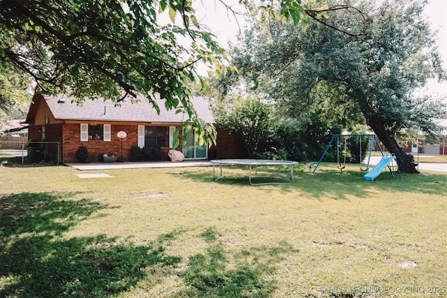 101 Honeysuckle Ln, Pryor, OK 74361 - view of yard with a trampoline, a playground, and a patio