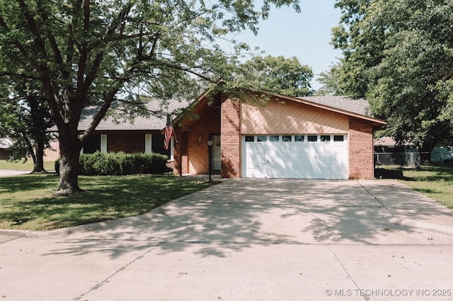 101 Honeysuckle Ln, Pryor, OK 74361 - view of front of home featuring a garage, concrete driveway, brick siding, and a shingled roof