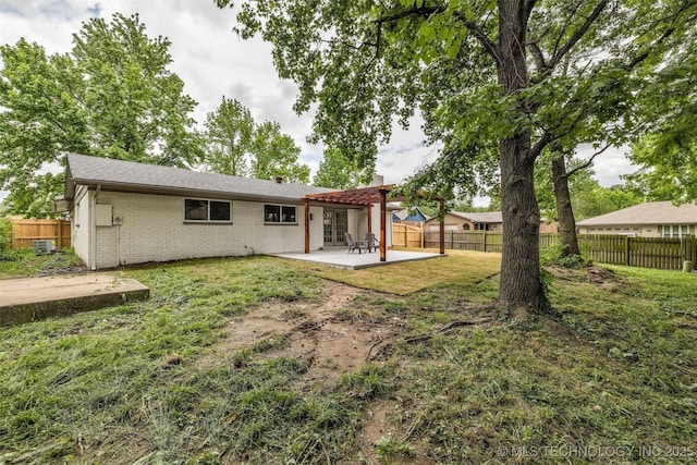 7362 S 68th E Ave, Tulsa, OK 74133 - back of property with a patio, brick siding, and a chimney