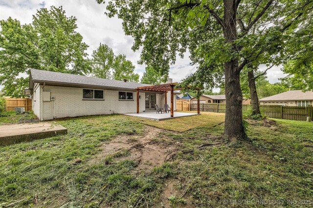 7362 S 68th E Ave, Tulsa, OK 74133 - rear view of house featuring a patio area, brick siding, and a chimney