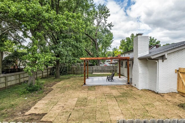 7362 S 68th E Ave, Tulsa, OK 74133 - view of yard featuring a pergola and a patio area