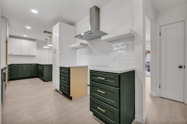 7362 S 68th E Ave, Tulsa, OK 74133 - kitchen with green cabinets, island range hood, light wood finished floors, tasteful backsplash, and white cabinets