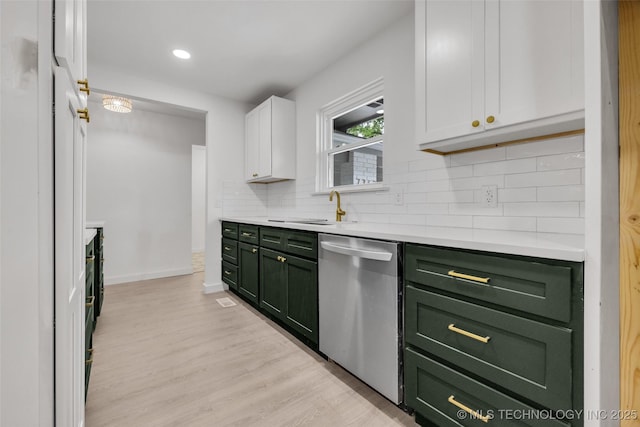 7362 S 68th E Ave, Tulsa, OK 74133 - kitchen featuring green cabinets, stainless steel dishwasher, a sink, tasteful backsplash, and white cabinetry