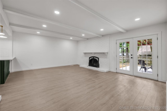 7362 S 68th E Ave, Tulsa, OK 74133 - unfurnished living room with beamed ceiling, light wood-style flooring, french doors, baseboards, and recessed lighting