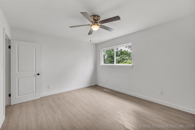 7362 S 68th E Ave, Tulsa, OK 74133 - unfurnished room featuring wood finished floors, ceiling fan, and baseboards