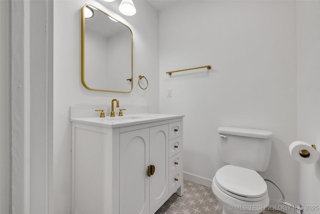 7362 S 68th E Ave, Tulsa, OK 74133 - half bath with vanity, toilet, and baseboards