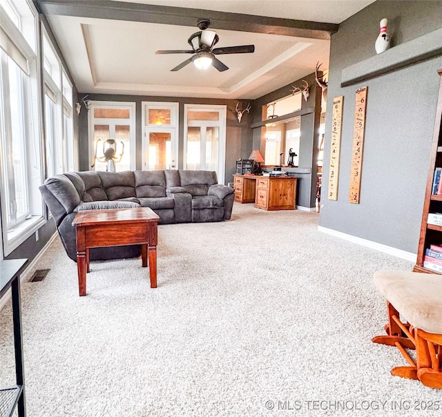 4418 N Little, Cushing, OK 74023 - living area featuring light carpet, a raised ceiling, a ceiling fan, and baseboards