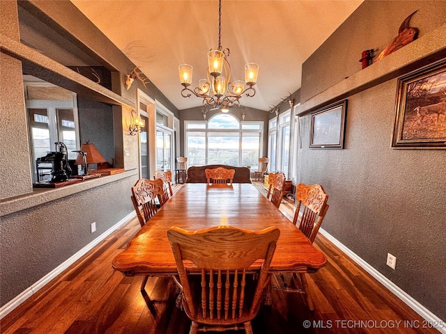 4418 N Little, Cushing, OK 74023 - dining room featuring a textured wall, a chandelier, hardwood / wood-style flooring, baseboards, and vaulted ceiling