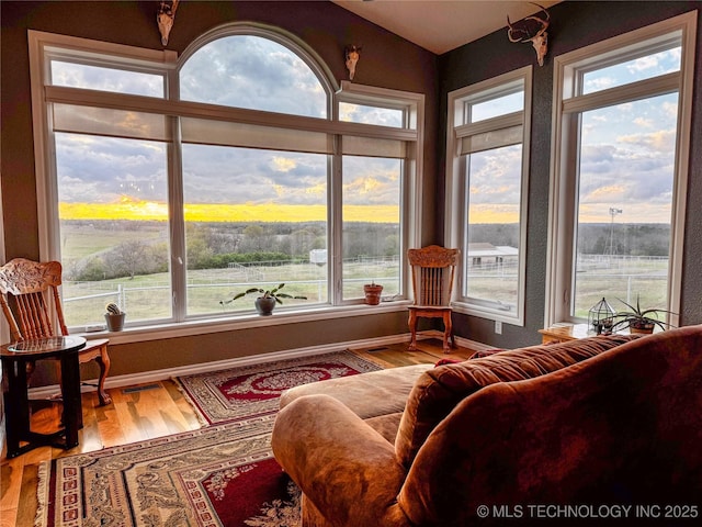 4418 N Little, Cushing, OK 74023 - sunroom with wood finished floors, lofted ceiling, and baseboards