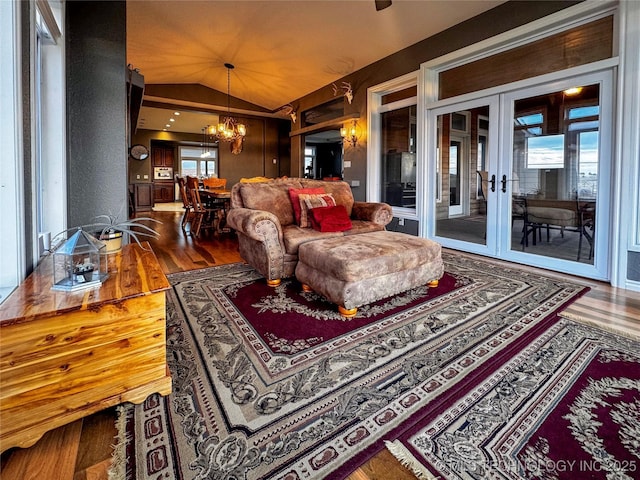 4418 N Little, Cushing, OK 74023 - living area featuring wood finished floors, a chandelier, french doors, and vaulted ceiling