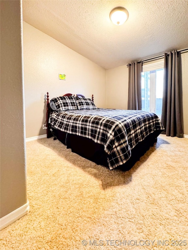 4418 N Little, Cushing, OK 74023 - bedroom featuring baseboards, carpet flooring, and a textured ceiling