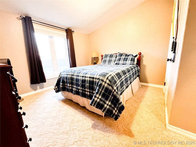 4418 N Little, Cushing, OK 74023 - carpeted bedroom featuring baseboards and lofted ceiling