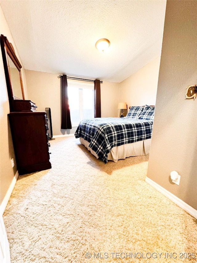 4418 N Little, Cushing, OK 74023 - carpeted bedroom with baseboards and a textured ceiling