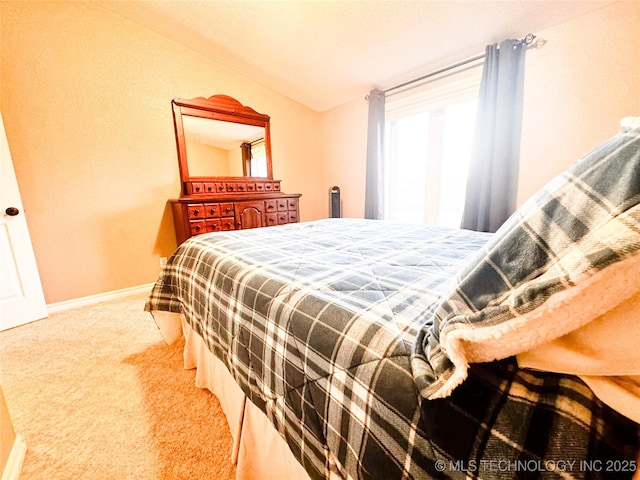 4418 N Little, Cushing, OK 74023 - bedroom with multiple windows, carpet, baseboards, and vaulted ceiling