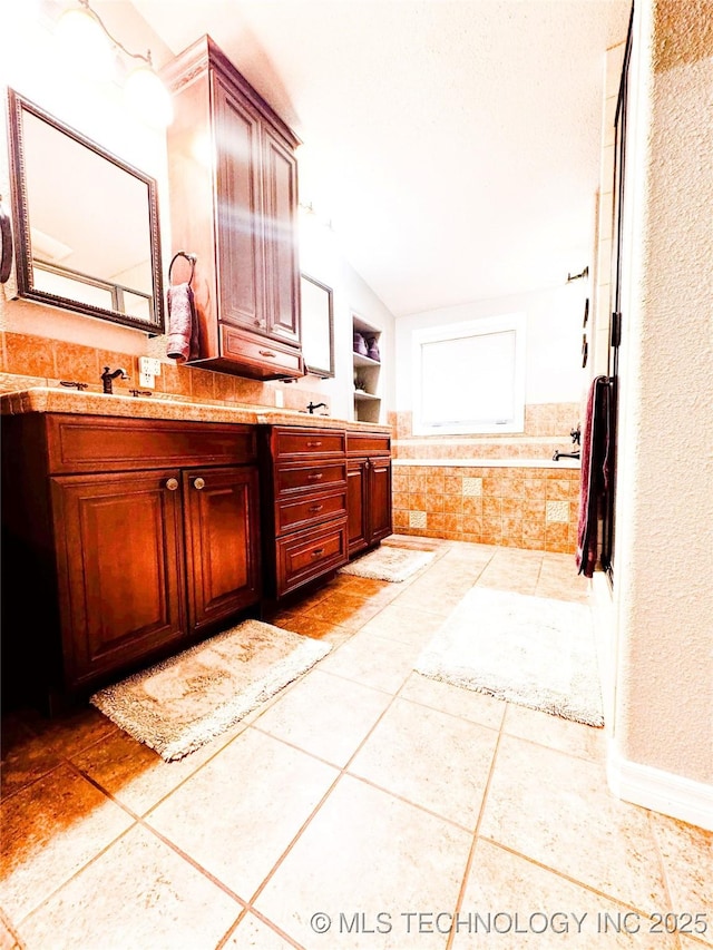 4418 N Little, Cushing, OK 74023 - full bath featuring vaulted ceiling, vanity, and tile patterned flooring