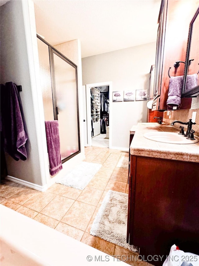 4418 N Little, Cushing, OK 74023 - full bath featuring vanity, a stall shower, tile patterned floors, and baseboards