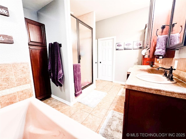 4418 N Little, Cushing, OK 74023 - bathroom featuring a stall shower, tile patterned floors, double vanity, and a bath