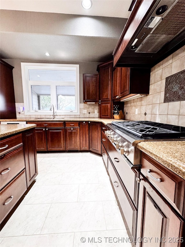 4418 N Little, Cushing, OK 74023 - kitchen with exhaust hood, a sink, tasteful backsplash, light stone counters, and stainless steel gas cooktop