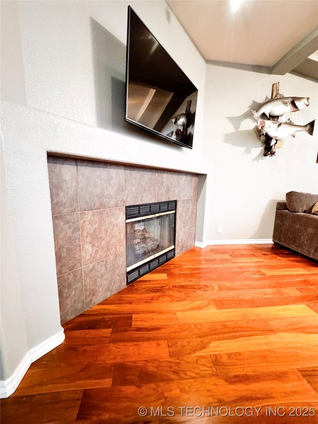 4418 N Little, Cushing, OK 74023 - unfurnished living room with a fireplace, wood finished floors, and baseboards