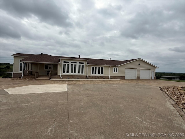 4418 N Little, Cushing, OK 74023 - ranch-style home featuring driveway, a garage, and covered porch