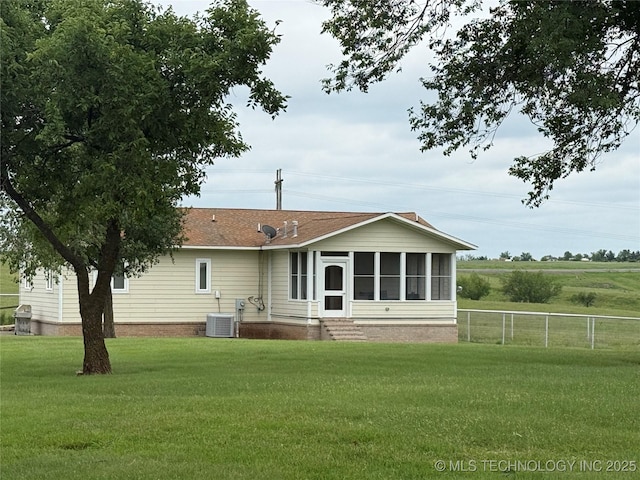 4418 N Little, Cushing, OK 74023 - back of property with a sunroom and central AC