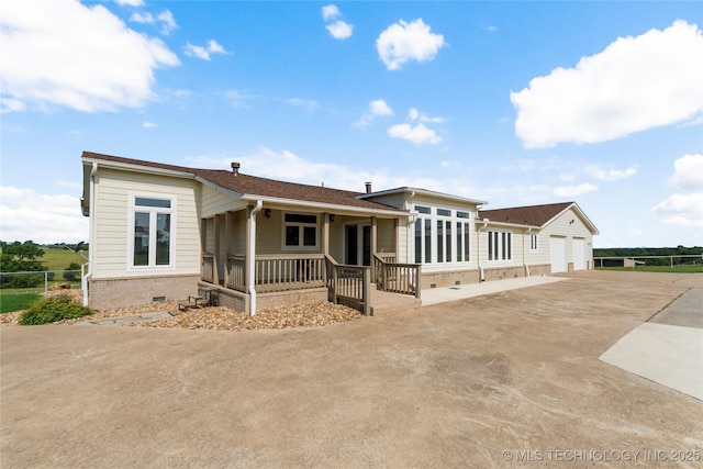 4418 N Little, Cushing, OK 74023 - view of front of home with covered porch, crawl space, and a detached garage