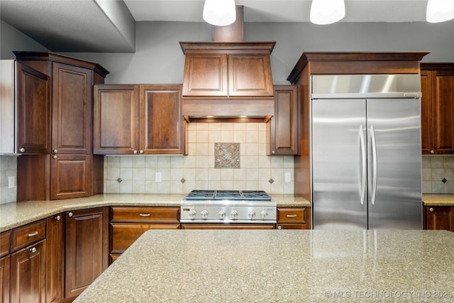 4418 N Little, Cushing, OK 74023 - kitchen featuring built in refrigerator, backsplash, stove, and light stone counters