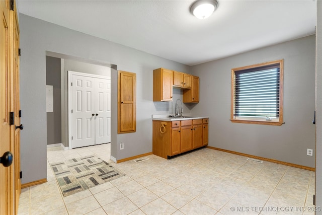 4418 N Little, Cushing, OK 74023 - kitchen featuring light countertops and light tile patterned floors