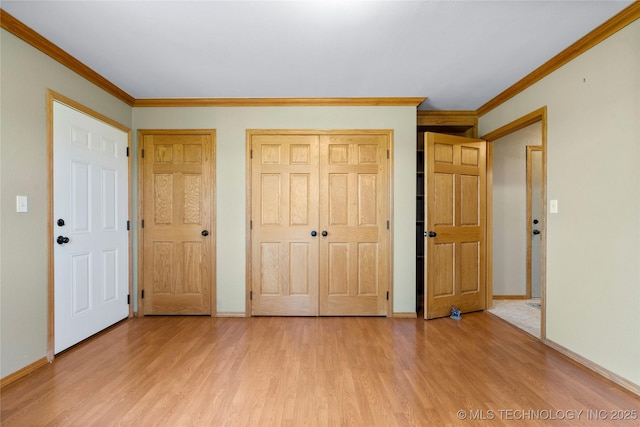 4418 N Little, Cushing, OK 74023 - unfurnished bedroom with light wood-style floors, ornamental molding, and a closet
