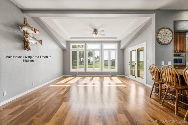 4418 N Little, Cushing, OK 74023 - dining space featuring a tray ceiling, ceiling fan, and wood finished floors