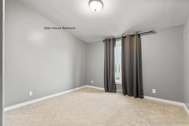 4418 N Little, Cushing, OK 74023 - spare room featuring a textured ceiling and carpet flooring