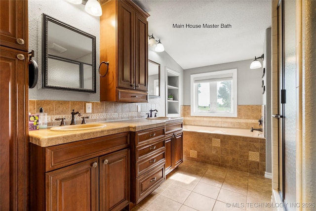 4418 N Little, Cushing, OK 74023 - full bathroom with a garden tub, vaulted ceiling, double vanity, tile patterned floors, and decorative backsplash