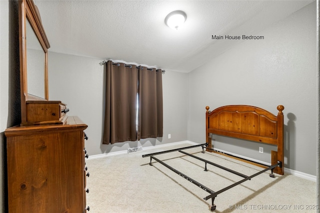 4418 N Little, Cushing, OK 74023 - carpeted bedroom featuring baseboards and a textured ceiling