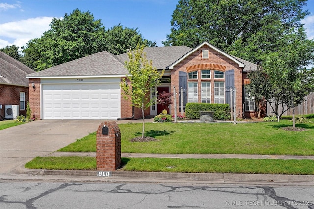 900 N Hemlock Ave, Broken Arrow, OK 74012 - view of front of home featuring ac unit, brick siding, concrete driveway, an attached garage, and a front yard