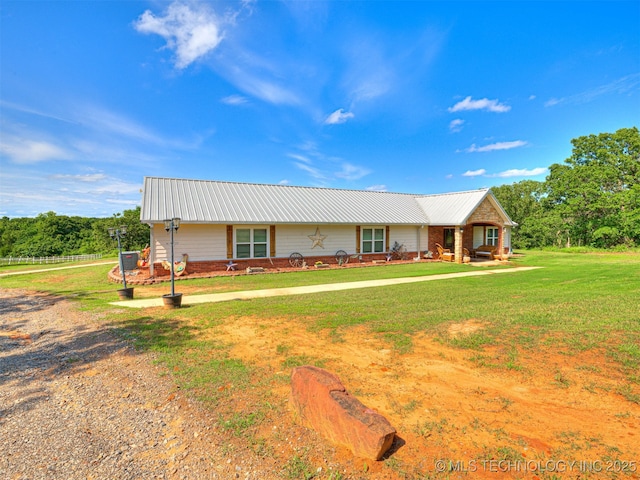 830294 S 3530, Stroud, OK 74079 - ranch-style house featuring metal roof and a front lawn
