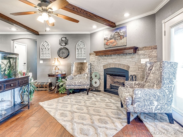 830294 S 3530, Stroud, OK 74079 - living room with hardwood / wood-style flooring, a ceiling fan, beam ceiling, a fireplace, and a textured wall