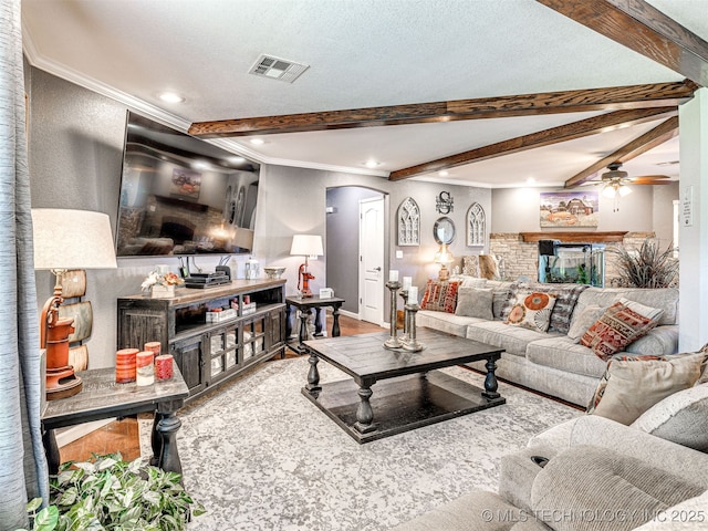 830294 S 3530, Stroud, OK 74079 - living room with arched walkways, ceiling fan, beamed ceiling, ornamental molding, and wood finished floors