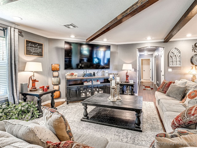 830294 S 3530, Stroud, OK 74079 - living room with wood finished floors, arched walkways, ornamental molding, recessed lighting, and beamed ceiling
