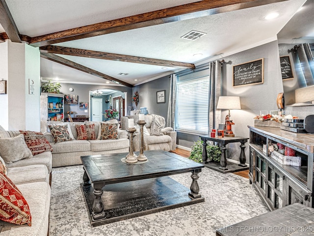 830294 S 3530, Stroud, OK 74079 - living area featuring crown molding, wood finished floors, a textured ceiling, beamed ceiling, and baseboards