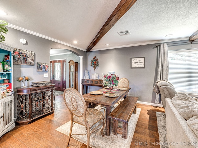 830294 S 3530, Stroud, OK 74079 - dining room with arched walkways, ornamental molding, a textured ceiling, a textured wall, and light wood-style floors