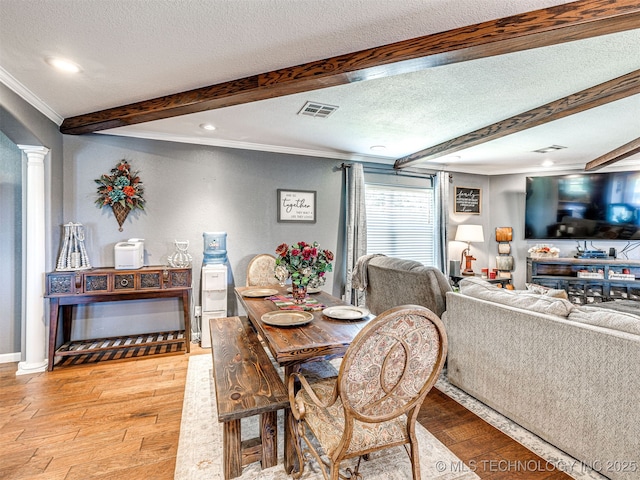 830294 S 3530, Stroud, OK 74079 - dining area with ornamental molding, beam ceiling, light wood-type flooring, decorative columns, and a textured ceiling