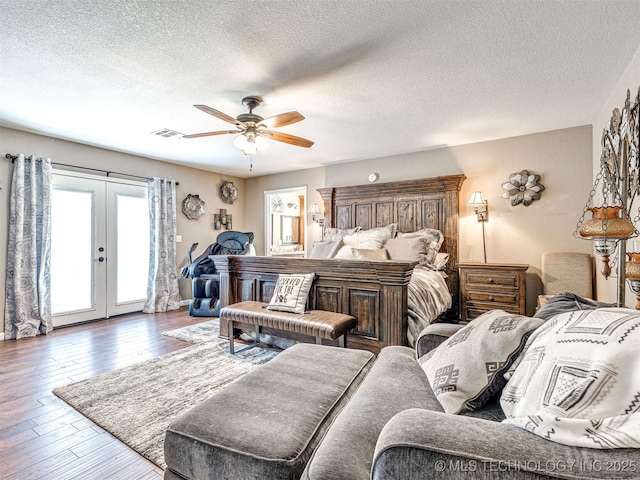 830294 S 3530, Stroud, OK 74079 - bedroom featuring access to outside, french doors, a textured ceiling, hardwood / wood-style flooring, and a ceiling fan