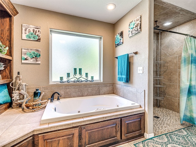 830294 S 3530, Stroud, OK 74079 - bathroom featuring a shower stall, a jetted tub, and a textured wall