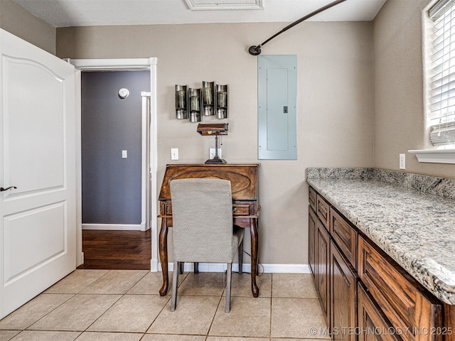 830294 S 3530, Stroud, OK 74079 - dining space with electric panel, light tile patterned floors, and baseboards